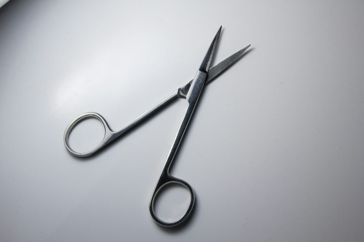 Surgical scissors on a work surface illustrating instrument sourcing and procurement