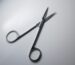 Surgical scissors on a work surface illustrating instrument sourcing and procurement